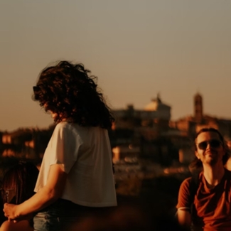 Adults-relaxing-on-a-rooftop-in-Rome